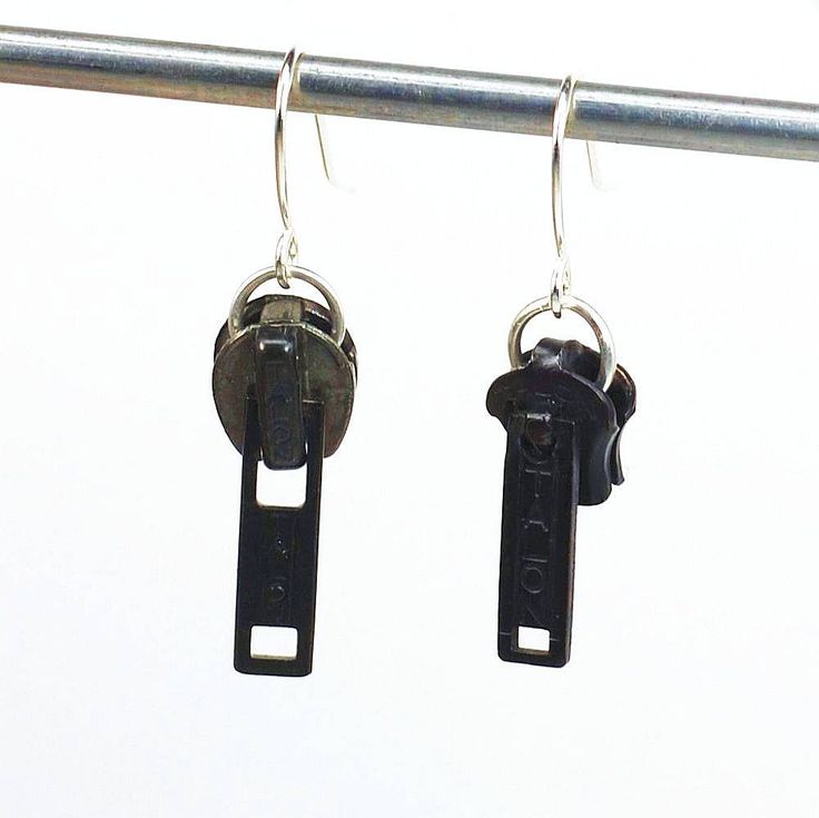 two pairs of black keys hanging from hooks