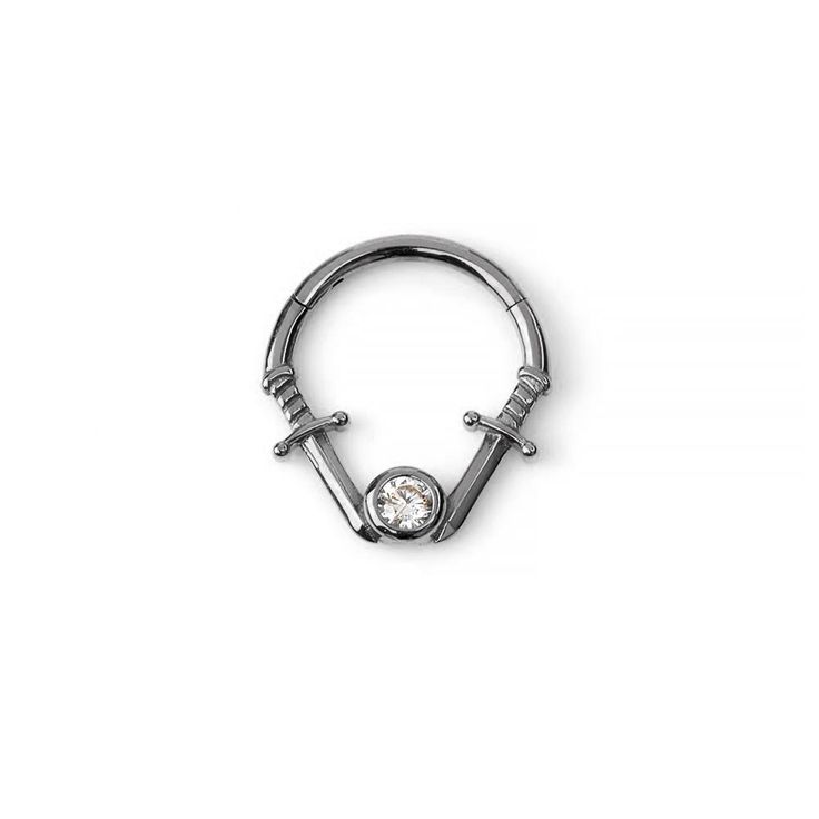 a silver nose ring with a diamond in the middle and two screws attached to it