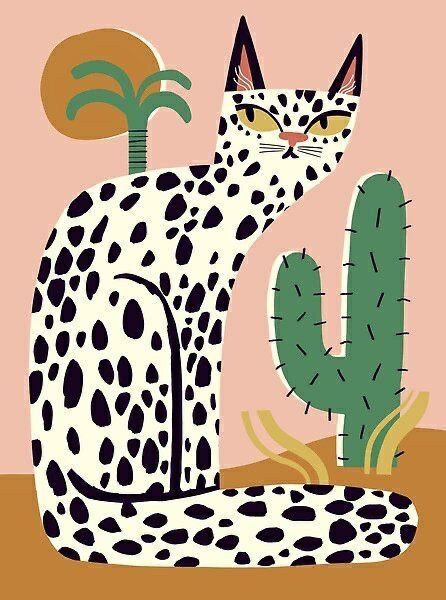 a black and white cat sitting next to a cactus