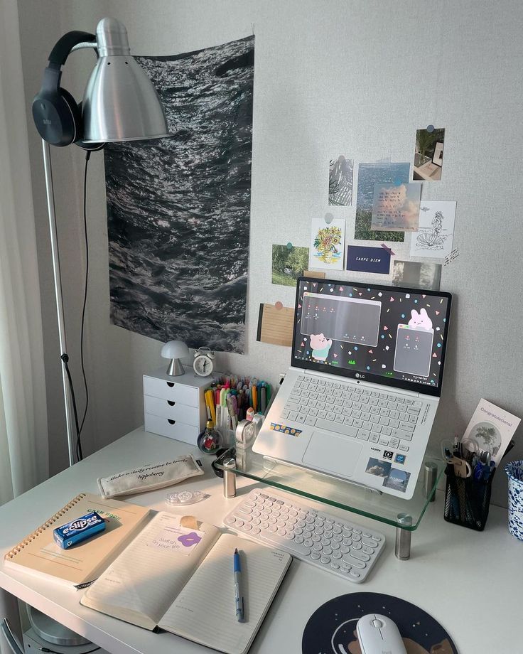 an open laptop computer sitting on top of a desk