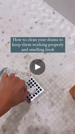 a person using a grater to clean a tiled floor