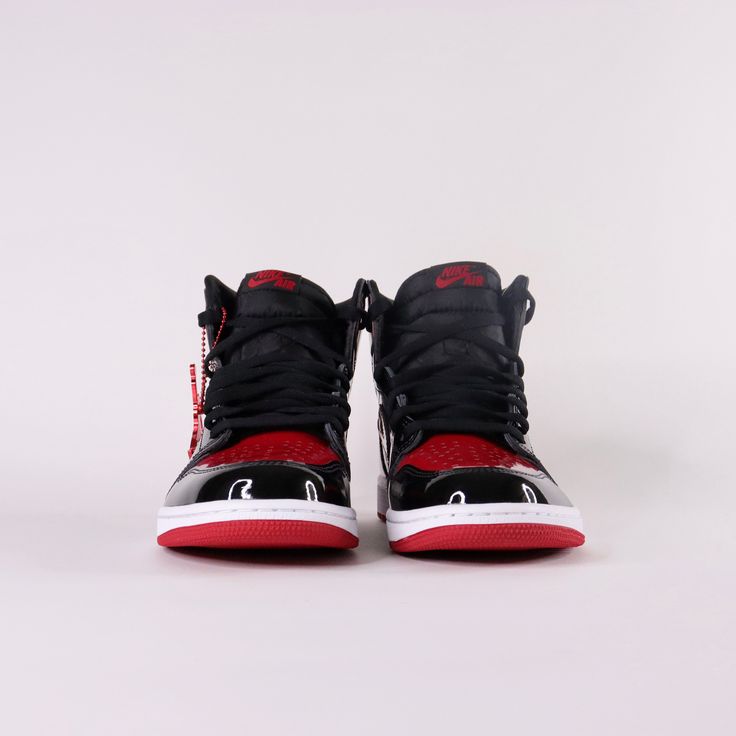 Debuted in 1985, the Air Jordan 1 Patent Bred offers a rendition to the iconic classic. Released December 30th, 2021. * Encapsulated Air Sole * Genuine patent leather in the upper offers durability * Air Jordan ball and wings logo on side * Black toe colour blocking Size and Fit* Fits true to size Leather Jordan Shoes With Laces For Streetwear, Jordan Lace-up Shoes With Boost Midsole For Streetwear, Streetwear Jordan Shoes With Lace-up Design, Leather Jordan Lace-up Shoes For Streetwear, Leather Jordan Shoes For Streetwear, Leather Lace-up Jordan Shoes For Streetwear, Leather Jordan Shoes With Boost Midsole For Streetwear, Leather Jordan Shoes For Streetwear With Branded Insole, Custom Lace-up Sneakers With Boost Midsole For Streetwear