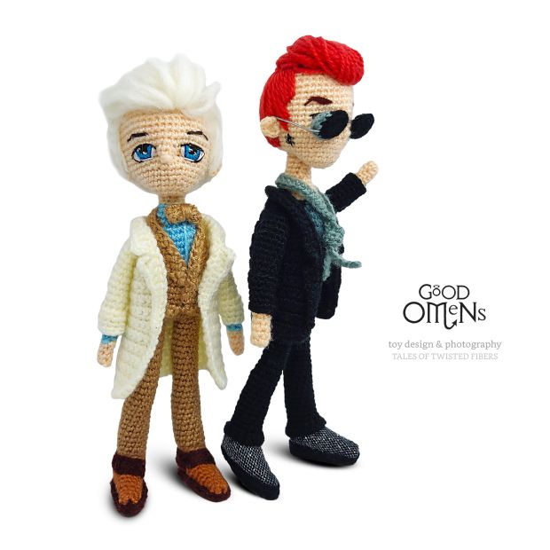 two crocheted dolls are standing next to each other, one is wearing a white coat and the other has red hair