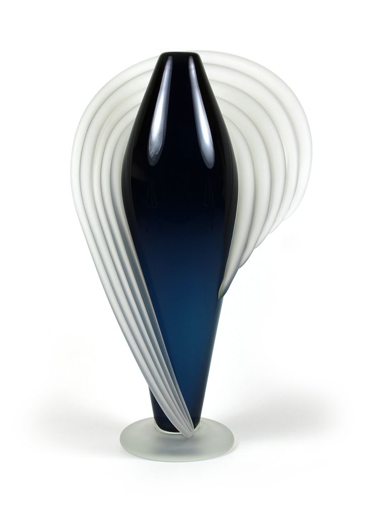 a black and white vase sitting on top of a table