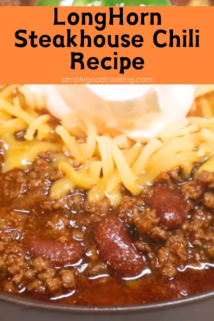 longhorn steakhouse chili recipe in a skillet with cheese and sour cream on top