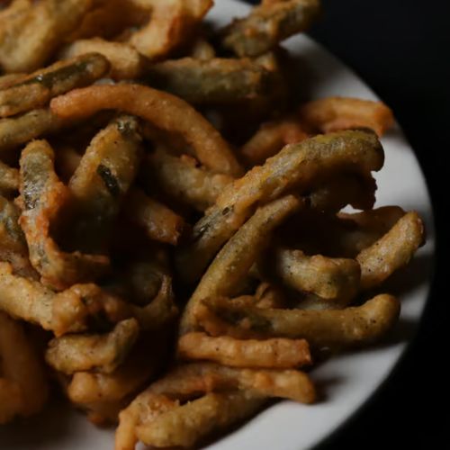 some fried food is on a white plate