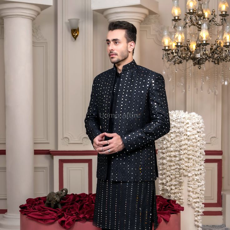 Elevate your wedding ceremony apparel with our lovely Luxury Black Prince Coat, exquisitely crafted for the cutting-edge gentleman. This ensemble capabilities a fully embroidered coat adorned with complex reflect work, making it a display-stopping piece that captures the essence of opulence and beauty. Paired with a traditional black kurta pajama, this outfit is best for any wedding ceremony birthday celebration, ensuring you make a lasting affect. Features:Elegant Design: The prince coat boasts Prince Coat Shalwar Kameez, Black Prince Coat, Black Tuxedo Suit, Waistcoat Designs, Prince Coat, Black Kurta, Sherwani Groom, Blue Tuxedos, Groom Shoes