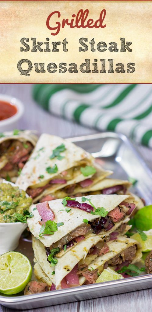 grilled steak quesadillas on a plate with lime wedges and salsa