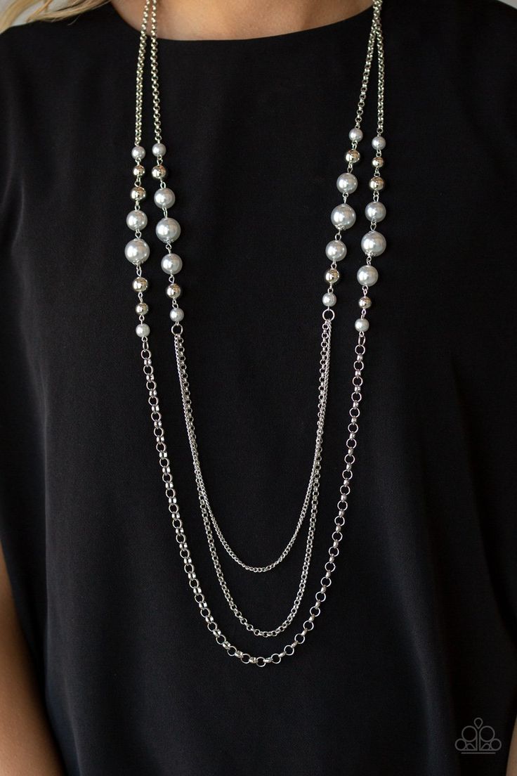 Two strands of oversized silver pearls and shiny silver beads give way to layers of mismatched silver chains down the chest for a colorfully refined flair. Features an adjustable clasp closure. Sold as one individual necklace. Includes one pair of matching earrings. Casual Silver Necklace For Party, Silver Necklace Set, Silver Pearl Necklace, Silver Bead Necklace, Silver Chains, Long Chain Necklace, Paparazzi Jewelry, Shiny Silver, Handmade Necklace