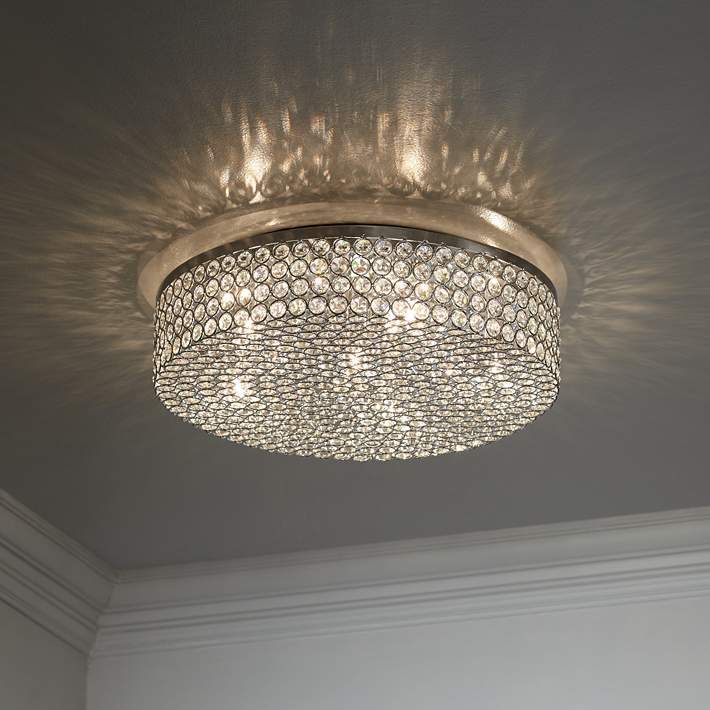 a chandelier hanging from the ceiling in a room