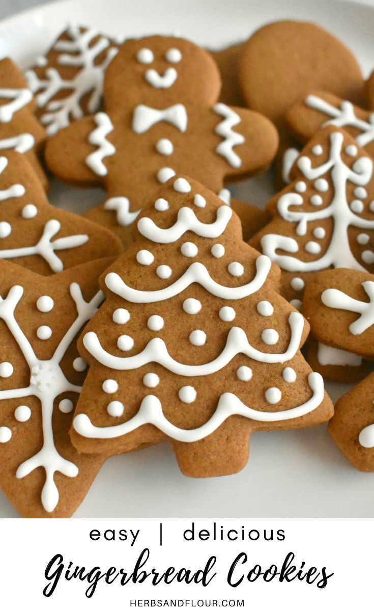 several ginger cookies decorated with white icing on a plate