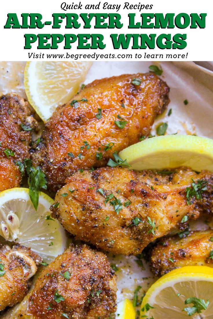 chicken wings with lemons and parsley on the side