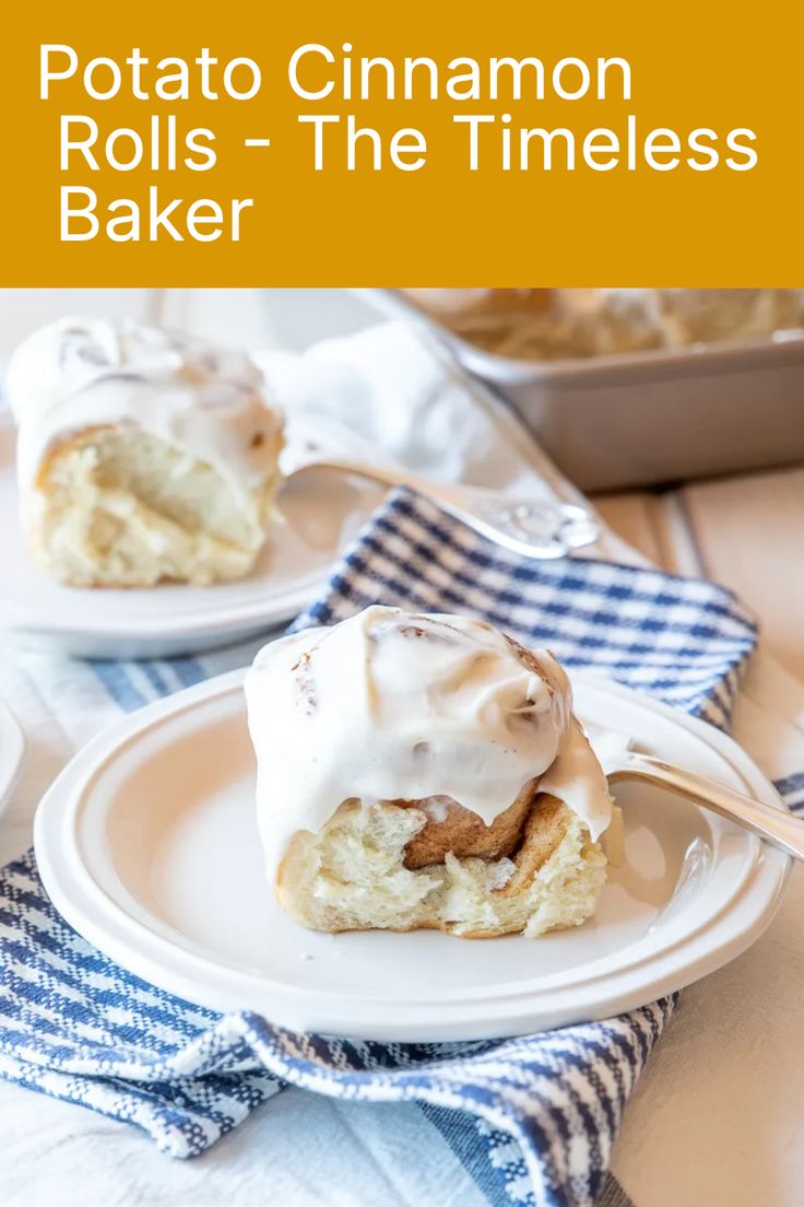 a white plate topped with cinnamon rolls covered in frosting and sitting on top of a blue checkered table cloth