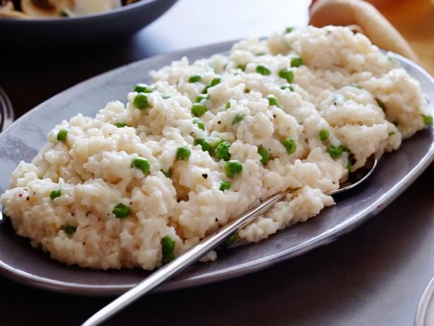 a plate with rice and peas on it