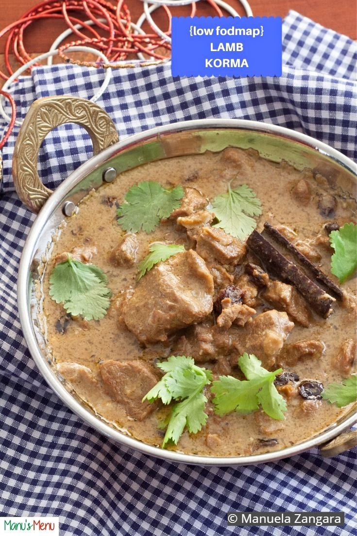 a bowl filled with meat and cilantro on top of a table