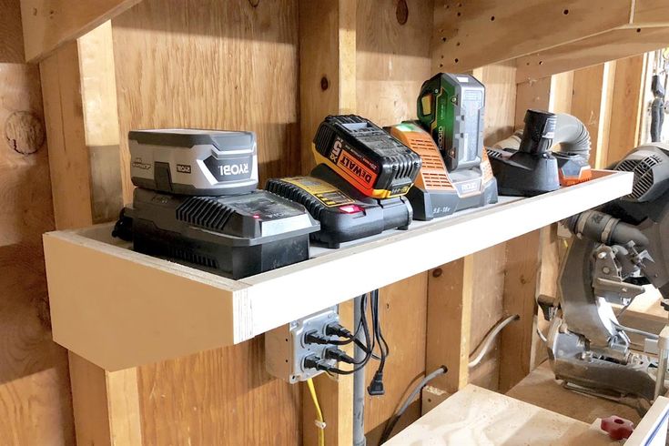 some tools are sitting on top of a shelf