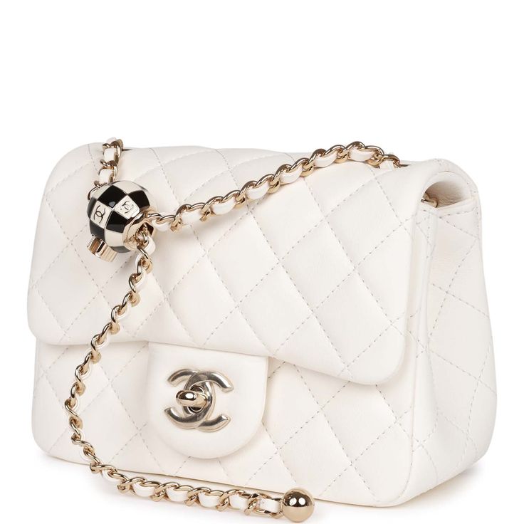 This Pearl Crush Mini Square flap bag is of white lambskin with light gold tone hardware and has a front flap with signature CC turnlock closure, rear half moon pocket, single interwoven white leather and light gold tone chain link shoulder/crossbody strap with adjustable "pearl" ball. The interior is lined in gold leather and features a zipper pocket with Chanel pull and an open pocket below. Collection: 23C Origin: Italy Condition: Pristine; new or never Accompanied by: Chanel box, Chanel dust Chanel Pearl Crush, Chanel Pearl, Chanel Box, Chanel Pearls, Chanel Model, Leather Thread, Prada Handbags, Chic Handbags, Outfit Casual