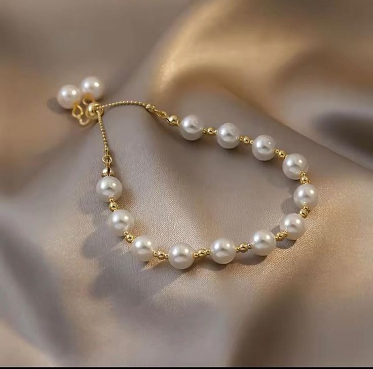 Classic Freshwater Pearl Jewelry (7-8 inches / 18-20 cm) this bracelet is a timeless accessory. Made with hypoallergenic and nickel-free materials, it's also gentle on sensitive skin. Ideal as a gift or a special treat for yourself, this bracelet will quickly become a cherished piece in any jewelry collection. Luxury Gold Jubilee Pearl Bracelet, Classic Adjustable Hypoallergenic Pearl Bracelet, Elegant Hypoallergenic Adjustable Beaded Bracelets, Elegant Adjustable Hypoallergenic Beaded Bracelets, Classic White Bracelets For Mother's Day, Classic Adjustable Hypoallergenic Chain Bracelet, Hypoallergenic Pearl Bracelet, White Resizable Pearl Bracelet For Gift, White Resizable Pearl Bracelet Gift