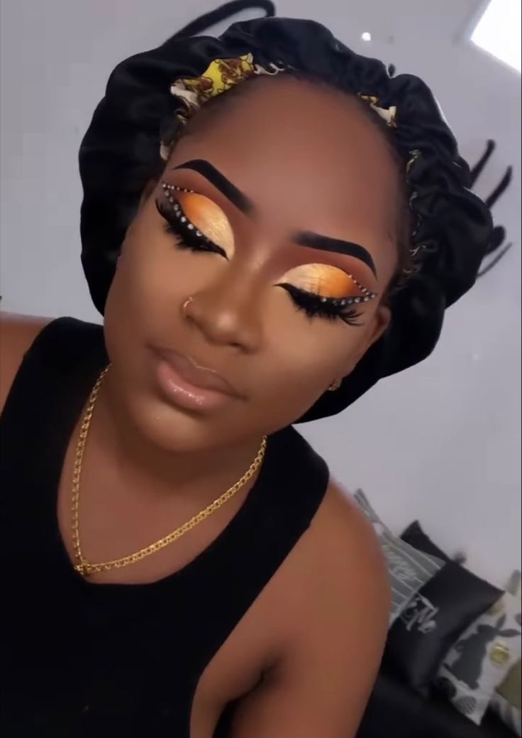 Makeup With Orange Eyeshadow, Orange Brown Makeup Looks, Burnt Orange Makeup Look Black Women, Fox Eye Makeup Black Women, Orange And Silver Makeup, Orange Makeup Looks Black Women, Full Glam Makeup Looks Black Women, Orange Makeup Looks, Coco Makeup