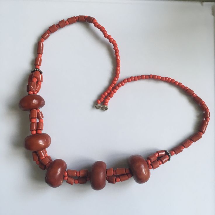 A resin beads necklace inspired by the traditional Amazigh tribal jewellery. A warm reddish maroon colour makes it a fantastically elegant Valentines' gift for your loved ones. All gifts come with complimentary wrapping and card. Fair Trade Orange Jewelry Gift, Orange Fair Trade Jewelry Gift, Orange Beaded Necklaces With Wooden Beads As Gift, Orange Beaded Necklaces With Wooden Beads For Gifts, Gift Red Coral Necklace With Large Beads, Amber Necklace With Wooden Beads For Gifts, Red Coral Necklaces With Large Beads For Gift, Red Coral Necklaces With Large Beads As Gift, Red Coral Necklace With Large Beads For Gift