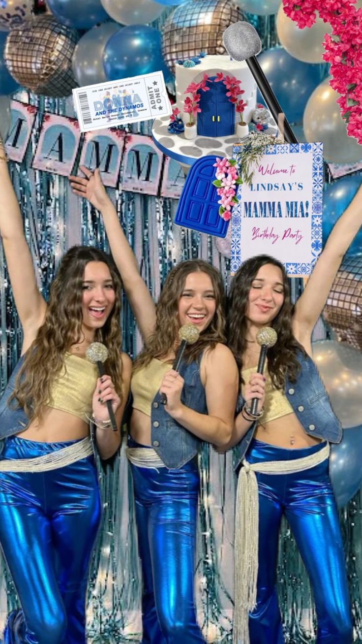 three women in blue and gold outfits are posing for a photo with balloons behind them