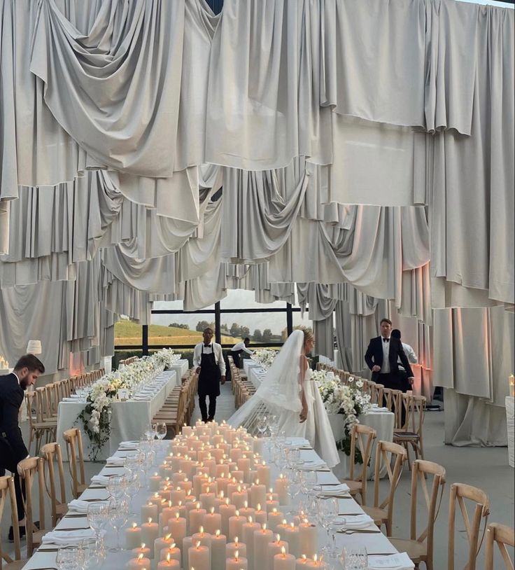 the bride and groom are getting ready to walk down the aisle at their wedding reception