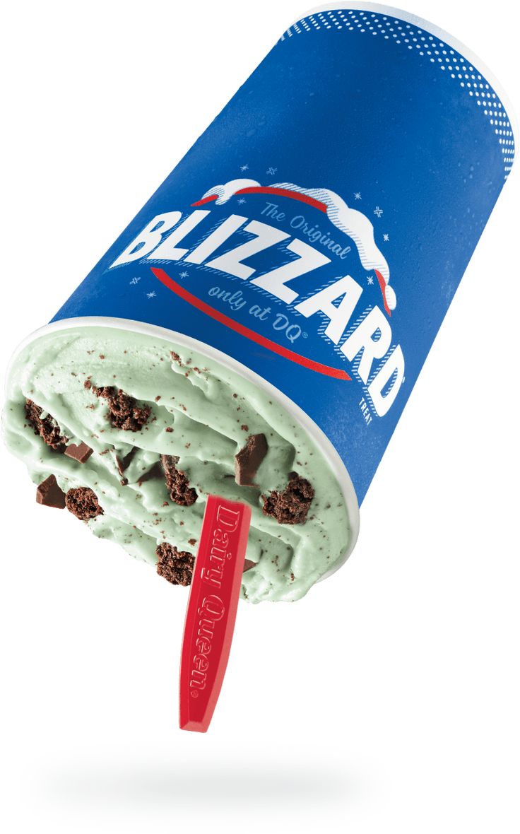 an ice cream sundae is being held up by a red plastic spoon with the word blizzard on it