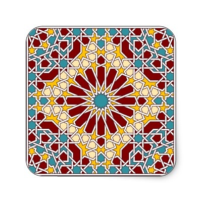 a square coaster with an intricate design in red, yellow and blue colors on it