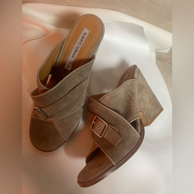 New. Size 38.5 Which Will Fit A 7.5-8. Taupe Suede. Silver Hardware. Suede Uppers, Leather Lining & Footbed, Leather Outsole. 3.5” Heels. No Original Box. Chic Slip-on Sandals With Heel Loop, Chic Suede Sandals Medium Width, Suede Mules With Wrapped Heel, Workwear Sandals With Stacked Heel And Almond Toe, Suede Sandals With Medium Width And Almond Toe, Suede High Heel Mules With Heel Strap, Suede Closed Toe Sandals For Work, High Heel Suede Mules With Heel Strap, Chic Suede Mules With Heel Strap