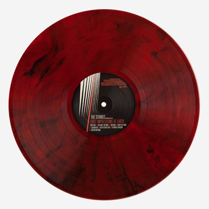 a red record with black and white writing on it