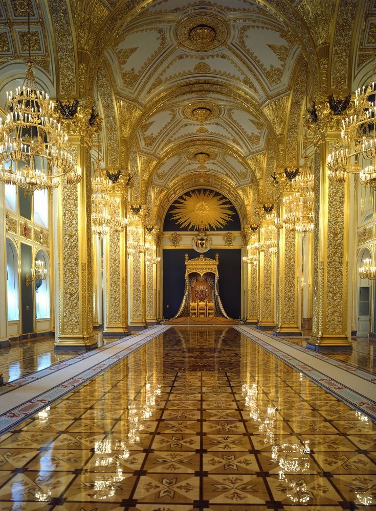 an ornate hall with chandeliers and marble flooring is shown in this image