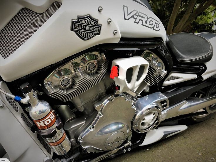 the engine of a motorcycle is shown in close up view with other parts visible on the bike