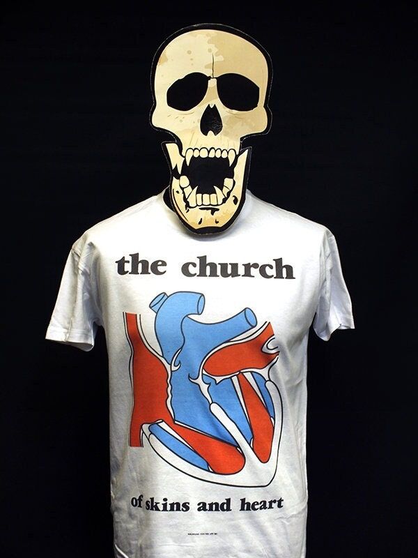 Of Skins and Heart is the debut album by the Australian psychedelic rock band The Church, released in April 1981 by EMI Parlophone. 23tees specialises in T-shirt design based on iconic record releases from the punk and post punk era.  We celebrate a truly inspired time in musical history by choosing a wide range of releases from both famous and more obscure bands.      T-shirts are made using the latest direct-to-garment technology - the ink is directly printed and sealed into the garment for a quality, durable and soft-finish shirt. Retro White T-shirt With Heart Graphic, White Band Merch T-shirt For Music Festivals, Fitted Band Merch T-shirt With Logo, Fitted Band Logo T-shirt, White Music-themed Graphic T-shirt, White Music-themed T-shirt With Graphic Design, Music-themed White Graphic T-shirt, Music-themed White T-shirt With Graphic Design, Retro Cotton T-shirt With Heart Graphic