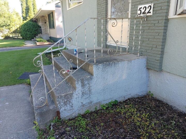 an old set of stairs in front of a house