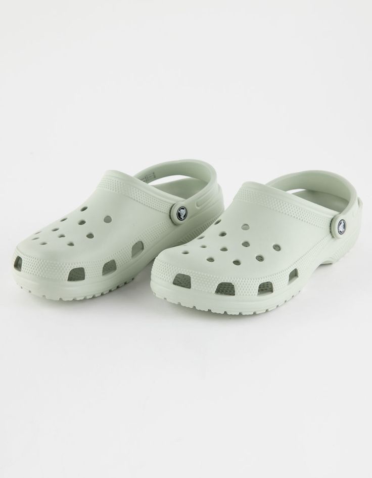 Crocs Classic Clogs. Original. Versatile. Comfortable. Easy On, Easy Off! Just Like The Adult Classic, The Kids' Version Offers Amazing Comfort And Support, Thanks To The Light, Durable Croslite™ Material And Molded Design. Kids Can Customize Their Crocs Clog However They Like; Ventilation Holes Accommodate Jibbitz™ Brand Charms. Pivoting Heel Straps For A More Secure Fit. Easy To Clean. Customizable With Jibbitz™ Charms. Iconic Crocs Comfort™: Lightweight. Flexible. 360-Degree Comfort. Imported Crocs Colors, Kevin 11, Crocs Aesthetic, Kids Crocs, Cute Summer Shirts, White Crocs, Lulu Pants, Crocs Clog, Preppy Shoes