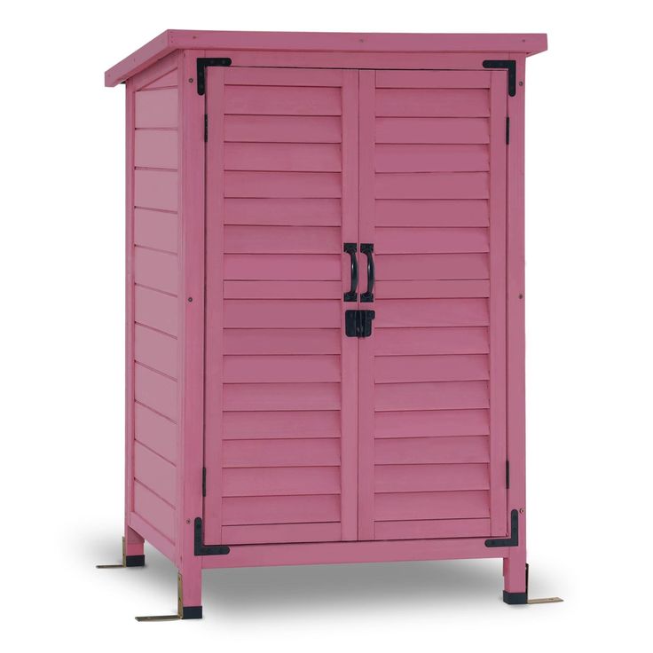 a pink storage cabinet with black handles