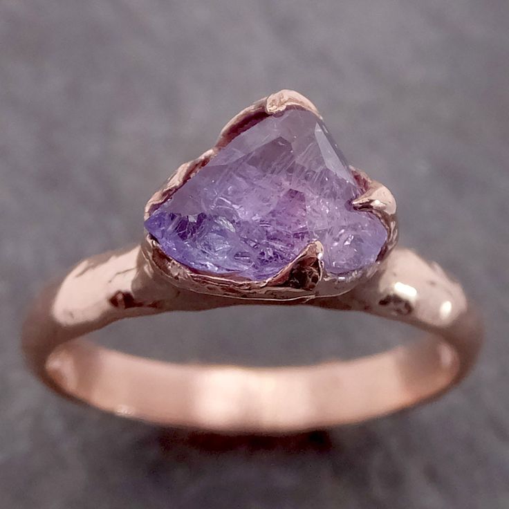 Partially faceted (by my husband) Purple/Lavender Sapphire Solitaire. I hand carved this ring in wax and cast it in recycled solid 14k rose gold using the lost wax casting process. This one of a kind raw gemstone ring is a size 7 it can be resized. The sapphire stone measures about 7mm X 7mm. The bandwidth is about 3mmThroughout all time and history in every tribe and culture all around the world crystals minerals and gemstones have used for healing, luck, divination, adornment vibrational medic Lavender Sapphire, Gemstone Engagement Ring, Rough Diamond Ring, Raw Gemstone Ring, Gold Solitaire Ring, Wedding Rings Solitaire, Purple Sapphire, Gemstone Engagement, Wax Casting