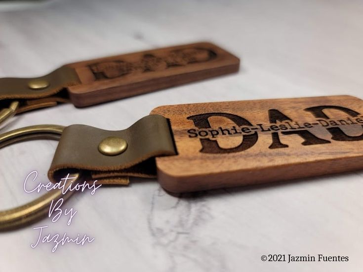 Surprise your father with one of these elegant, personalized wooden keychains with his child(ren)'s name on it! This is such a thoughtful, yet simple gift that he will love and carry with him everywhere he goes. The keychain is made of wood, and engraved using a laser cutting machine. The thickness of the material is approximately .19 inch, which makes this keychain very durable. The size is about 2-5/8" inches long, and 1-1/8" inch wide, but this can vary slightly from piece to piece. I can add Diy Laser Engraver, Children Names, Custom Keychains, Dad Keychain, Laser Projects, Wooden Keychain, Simple Gift, Wood Vase, Unique Presents