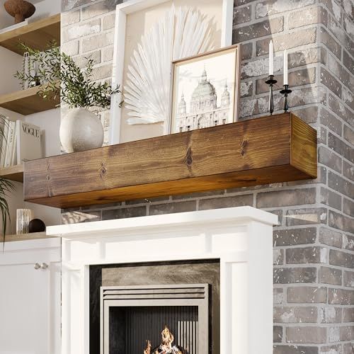 a fire place in a living room with pictures on the wall and shelves above it