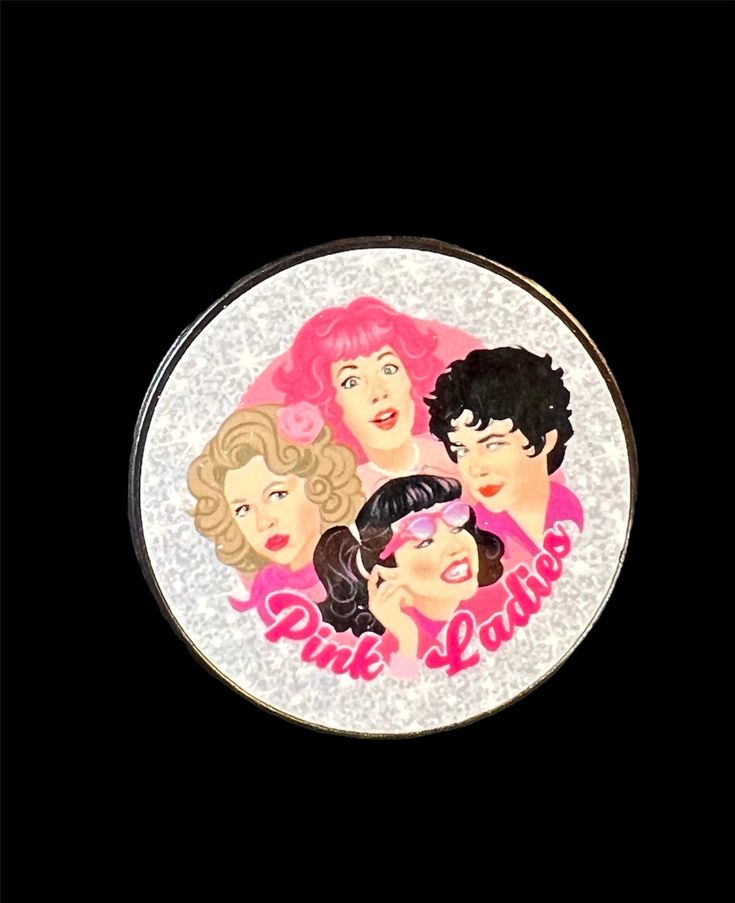 a compact mirror with the words one love on it and three women's faces