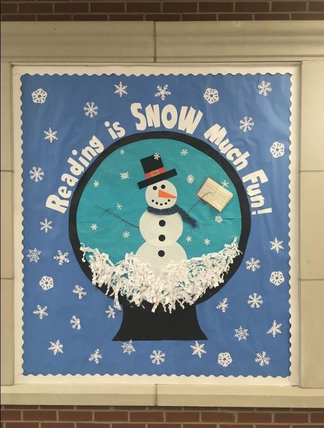 a bulletin board with a snowman in the middle