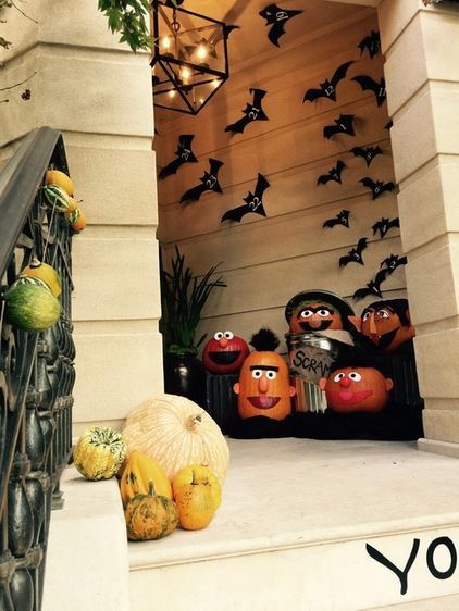 an image of halloween decorations on stairs with the caption saying having a monster inside that is called pumpkins