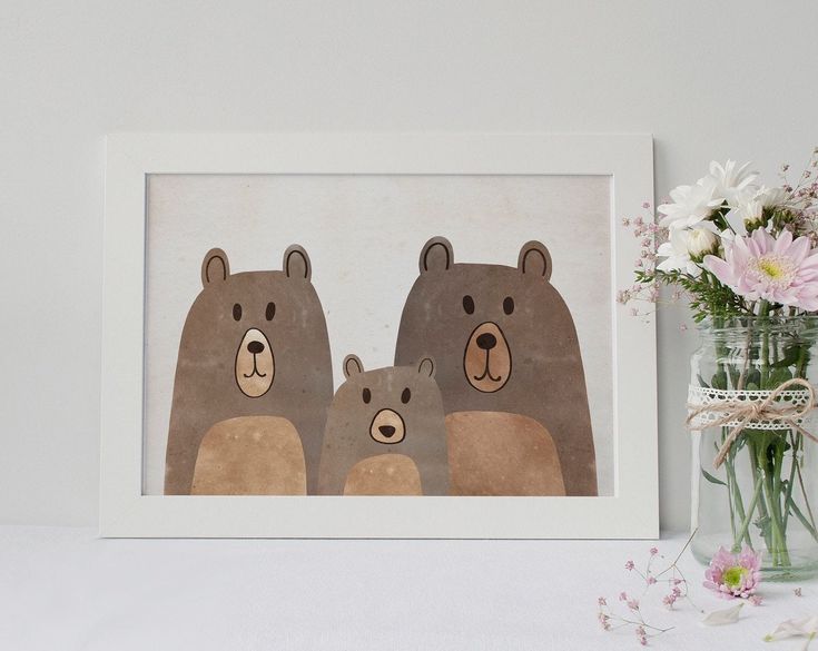 two brown bears standing next to each other in front of a vase filled with flowers