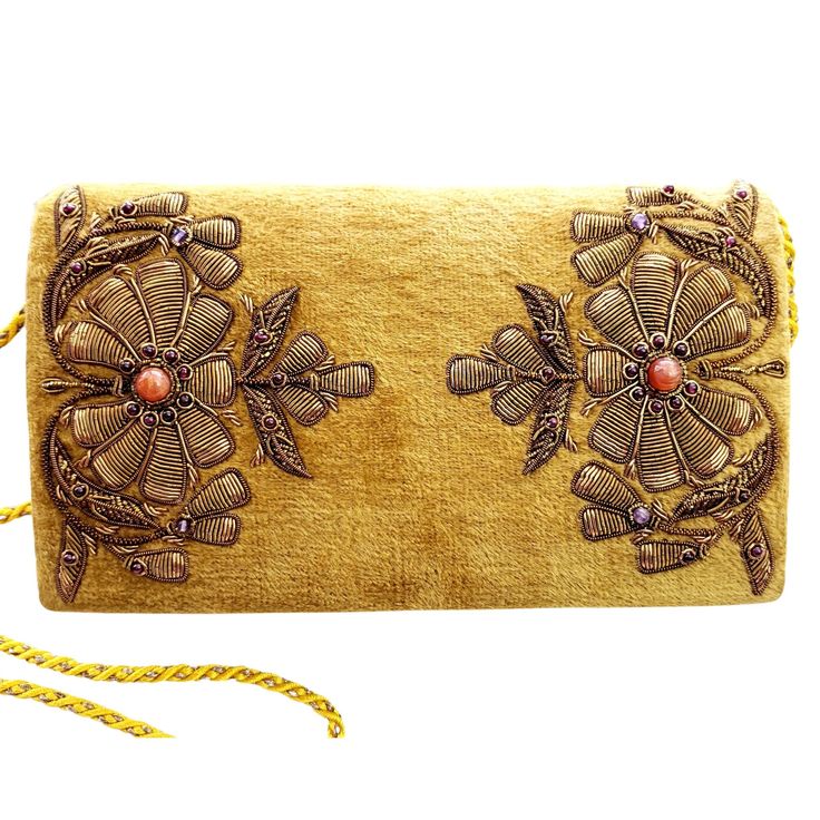 "Looking for a unique and beautiful purse? Here it is! A gold yellow velvet clutch bag embroidered with bronze flowers and inlaid with genuine semi precious stones, inlcuding orange carnelian and dark red garnets. Just the right amount of bling! Versatile, can be dressed up or down. Wear it to brunch with friends, to the theatre and just out for fun. Expertly hand embroidered by master zardozi artisans. Zardozi means \"gold thread\" or \"writing with gold\". It is an elaborate multidimensional e Bronze Flowers, Peacock Clutch, Velvet Clutch Bag, Formal Clutch, Hand Hold, Zardozi Embroidery, Floral Clutches, Beautiful Purse, Orange Carnelian