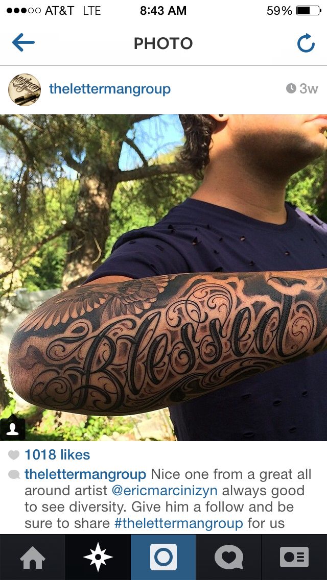 a man with a tattoo on his arm