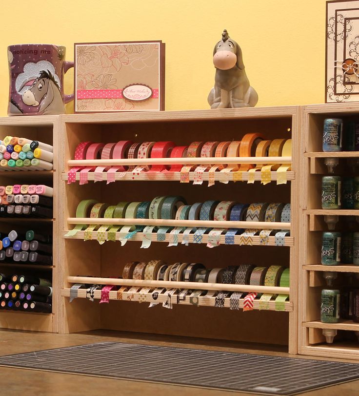 the shelves are filled with different types of craft supplies