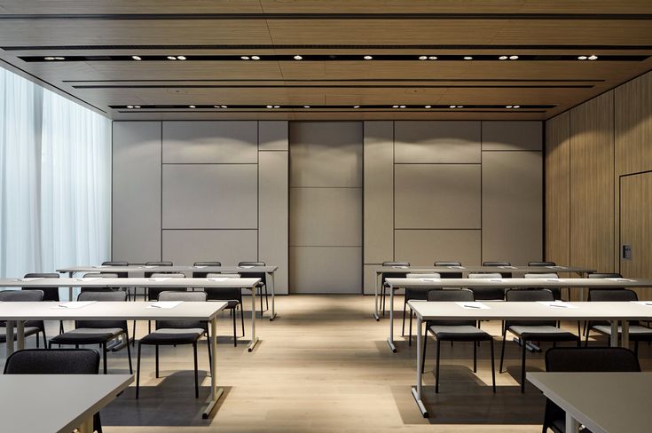 an empty classroom with desks and chairs