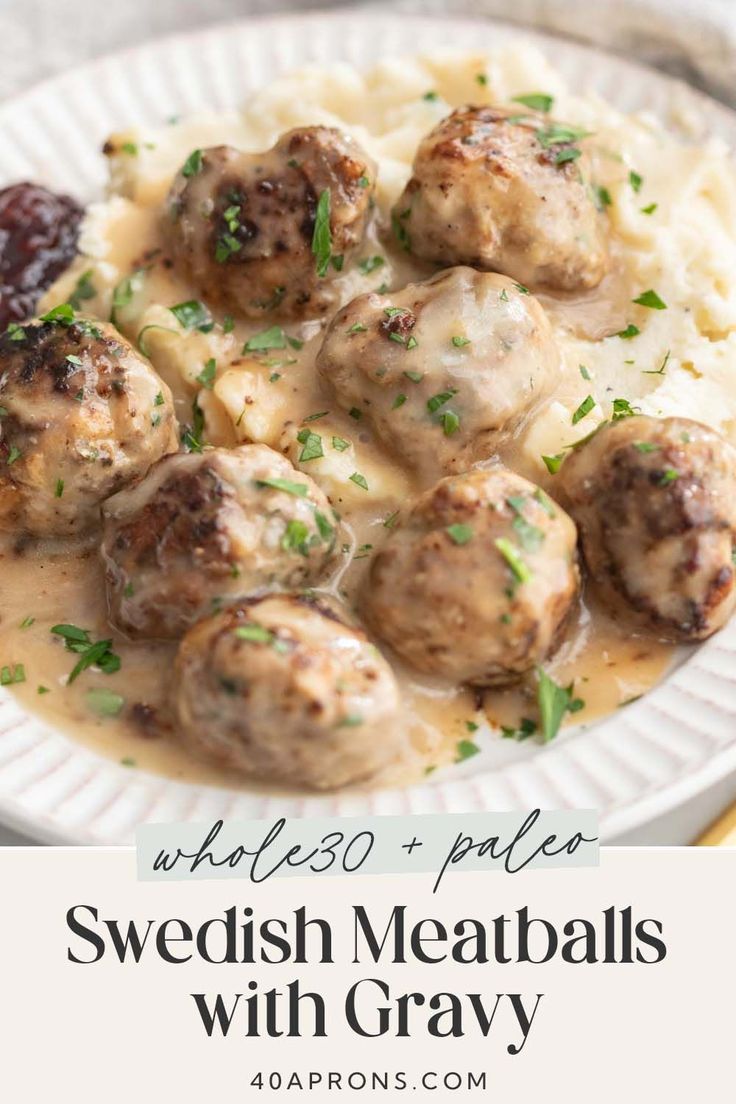 swedish meatballs with gravy on a white plate