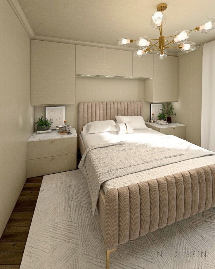 a bedroom with a bed, nightstands and a chandelier hanging from the ceiling