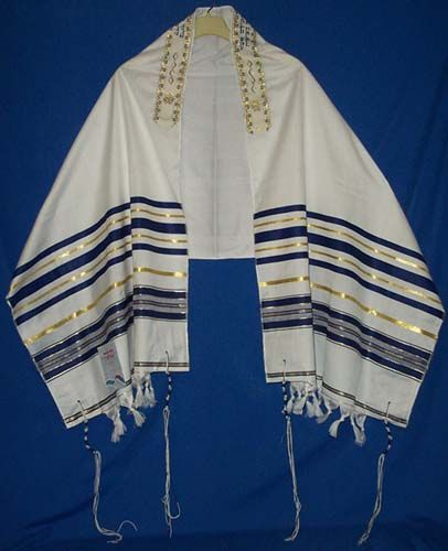 a white shawl with blue and gold stripes